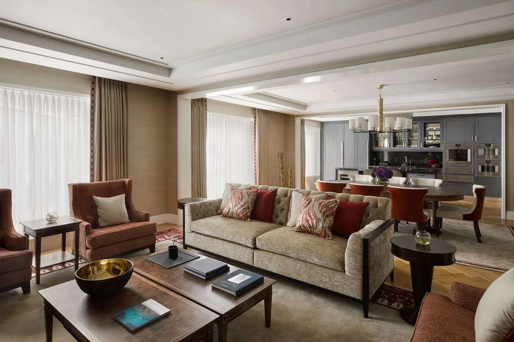 Ten Trinity, City of London: Living room with beige sofa and dining area beyond