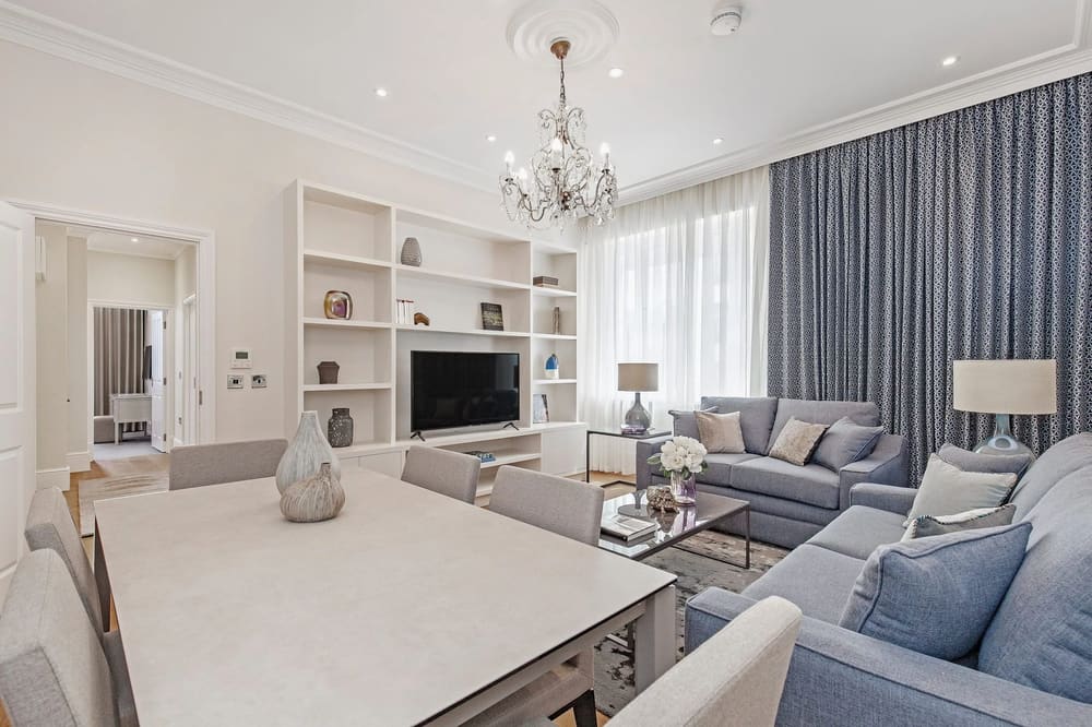 Chesham Place, Chelsea: Living room with chandelier and built-in shelving