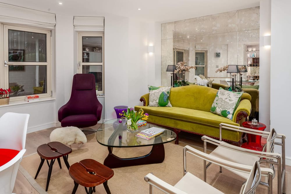 Covent Garden 2 bedroom near Opera House, Covent Garden: Living room with lime green sofa and purple armchair