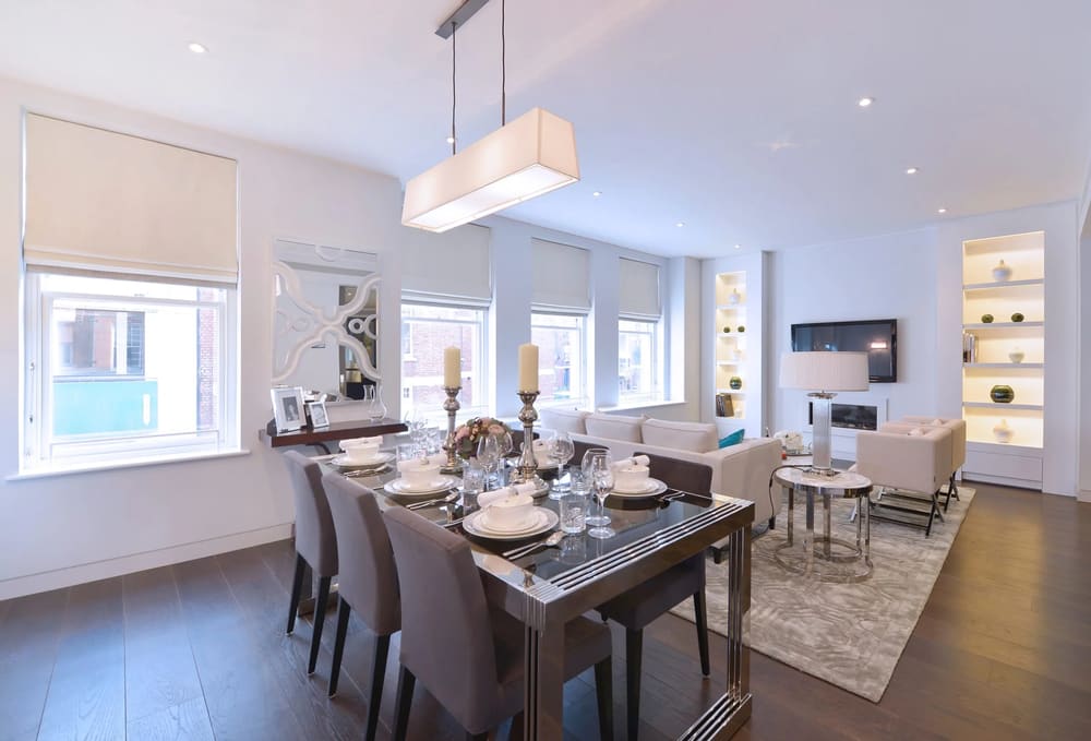 Duke St, W1K, Mayfair: Dining table set for eight in an open-plan room