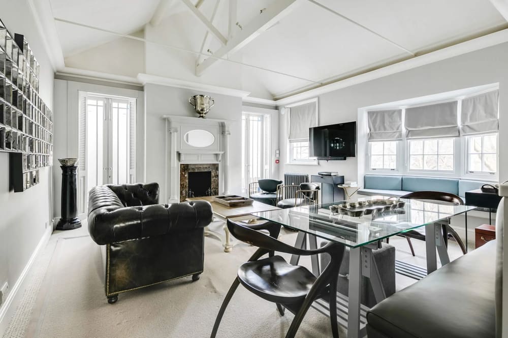 The North Audley Apartments, Mayfair: Living room with Chesterfield sofa and glass dining table