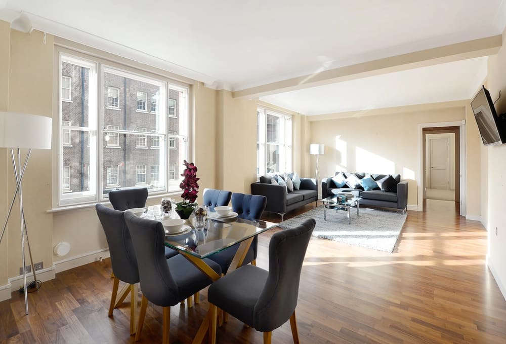 Hill St, W1K, Mayfair: Living and dining room with tall windows