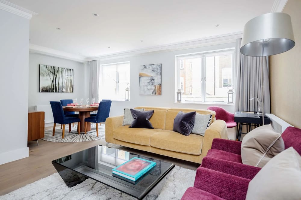Mayfair Mews Apartment II, Mayfair: Living room with mustard sofa and magenta chairs