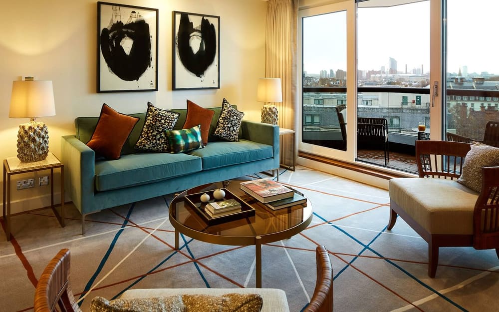 Gloucester Park, Kensington: Living room with teal sofa and terrace doors