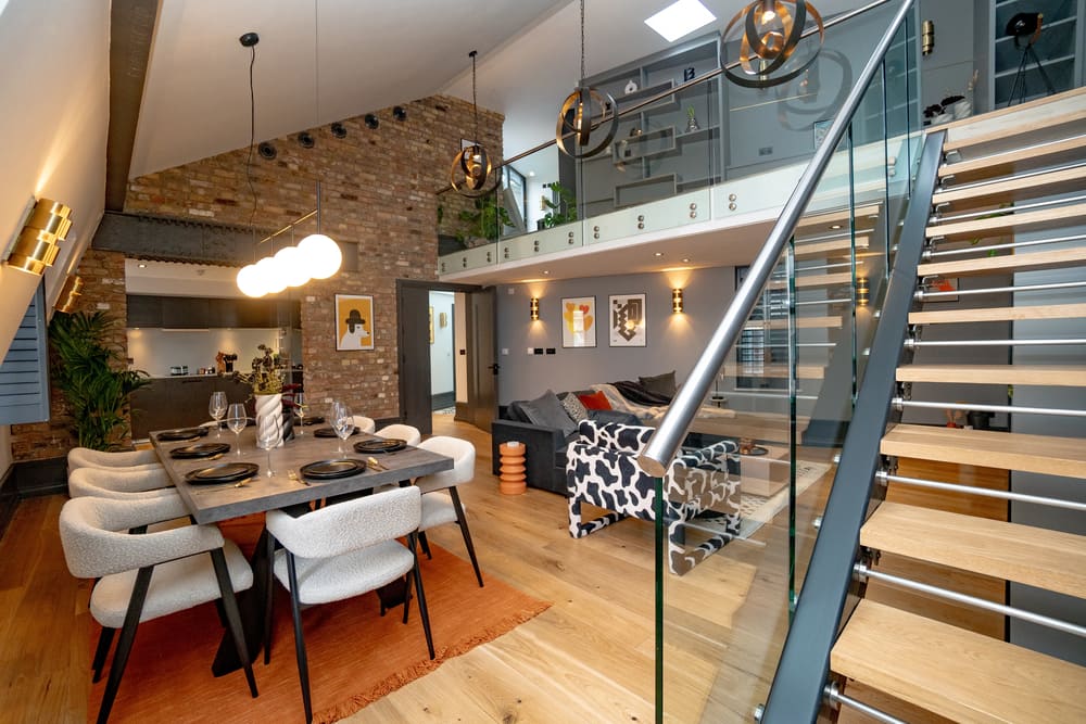 The Garrick Street Apartments, Covent Garden: Duplex living area with glass staircase and exposed brick