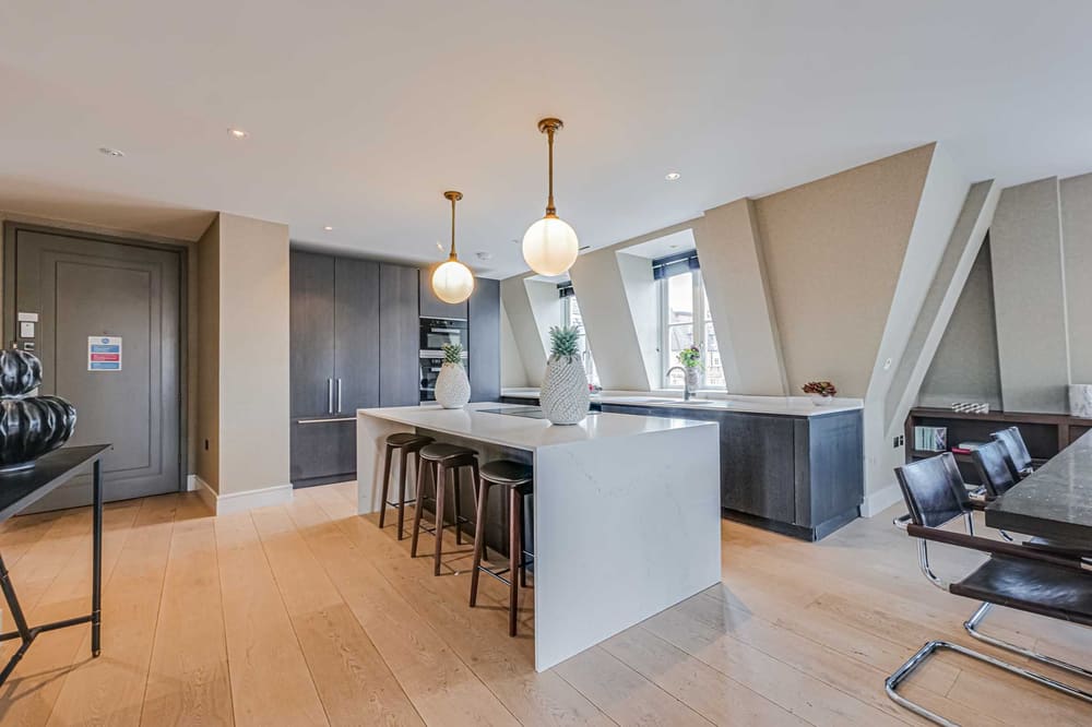 The Westminster Residences, Westminster: Kitchen with white island and bar stools