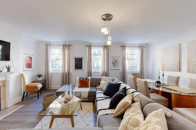 34–36 Clarges Street Apartments, Mayfair: Open living and dining room with pendant lights