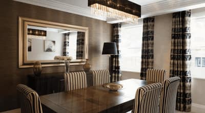 Beaufort House, Knightsbridge: Dining table beside kitchen and curtained windows