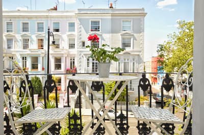 Portobello Serviced Apartments, Notting Hill: White terraced building with railings and entrance steps
