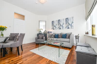 Daventry Street Two Bedroom Apartment, Marylebone: Living room with pale sofa and patterned rug