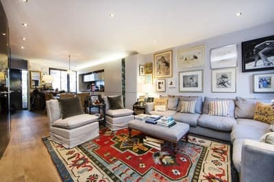 Elbe Street House, Fulham: Sitting room with fireplace and display shelves