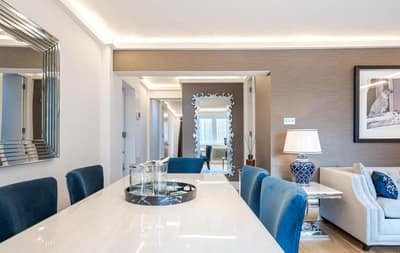 No. 8 Hans Crescent, Knightsbridge: Dining area with glass table and blue chairs