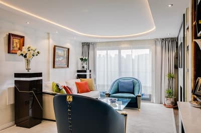 Horsley Court Two Bedroom Apartment, Westminster: Living and dining room with artwork and lamps