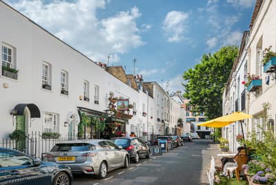 Kinnerton Street Three Bedroom House, Belgravia: Mews-style street with white houses and planting