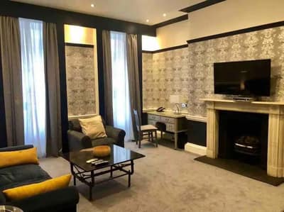 The Leonard Apartments, Marylebone: Living room with sofa and patterned feature wall