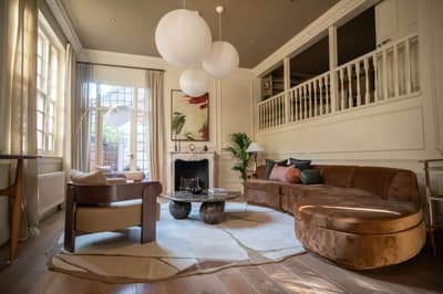 Melbury Cottage, Kensington: Living room with sofas and tall glazed doors