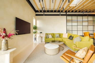 Noxley Fulham Three Bedroom Penthouse, Fulham: Loft living space with sofas and exposed beams