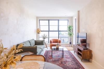 Noxley Fulham Two Bedroom Penthouse, Fulham: Living room with sofas and large windows