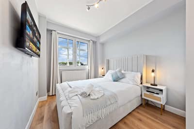 Regal Realms Paddington Two Bedroom, Paddington: Bedroom with double bed beside sash window