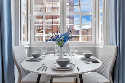 Regal Realms Paddington Two Bedroom, Paddington: Round dining table set beside large window