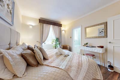 Shaw House, Mayfair: Double bedroom with tall curtained windows