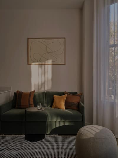 The Marloes, Earl's Court: Armchair beside a floor lamp and mirror