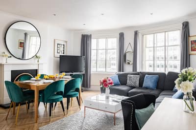 Westbourne Street Three Bedroom Apartment, Paddington: Dining area beside sofa and fireplace