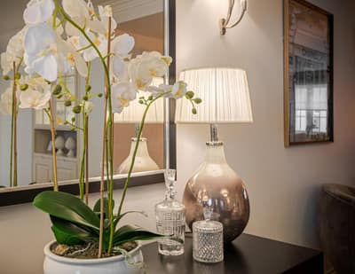 Wilton Row Three Bedroom House, Belgravia: Side table with vase beside upholstered chair