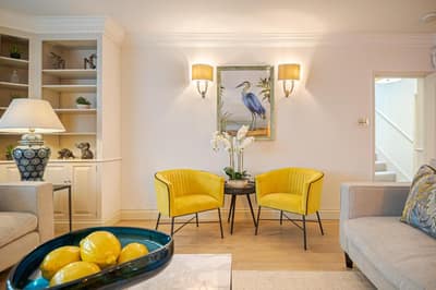 Wilton Row Three Bedroom House, Belgravia: Living area with yellow sofa and wooden floor
