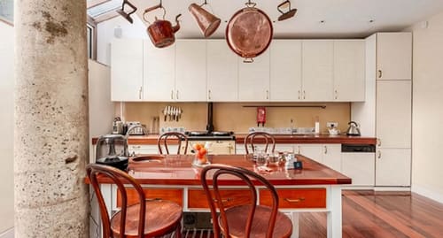 Notting Hill 3 bedroom near Ladbroke Grove, Notting Hill: Kitchen with copper pans and farmhouse table