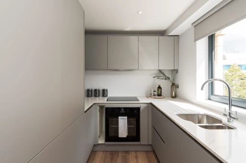 The Carlyle Apartments, Earl's Court: Kitchen with grey units and built-in oven