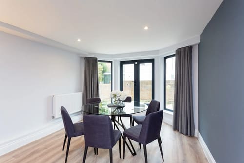 The Carlyle Apartments, Earl's Court: Dining table by French windows