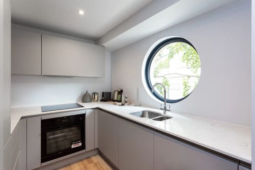 The Carlyle Apartments, Earl's Court: Kitchen with circular window