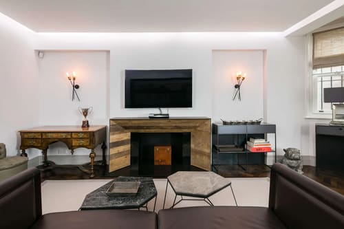 Prime Mayfair 1 bedroom no.4, W1K, Mayfair: Living room with fireplace and wall-mounted TV