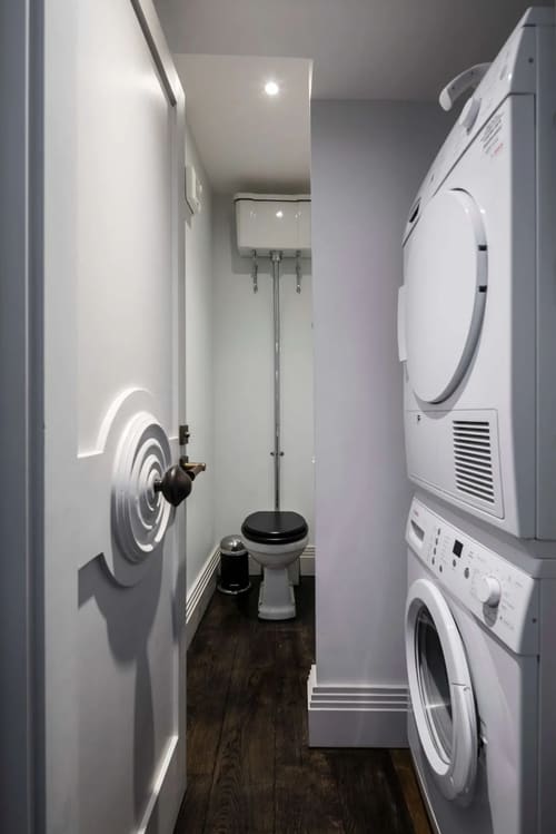 Prime Mayfair 1 bedroom no.4, W1K, Mayfair: WC with high-level cistern and washer-dryer