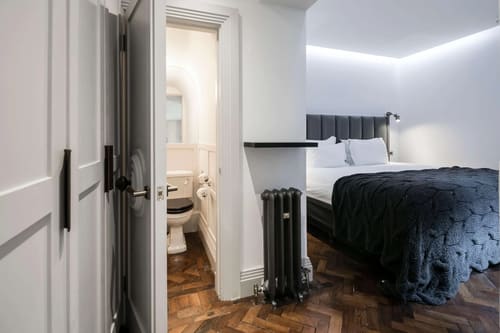 Prime Mayfair 1 bedroom no.4, W1K, Mayfair: Bedroom with herringbone floor and en-suite WC