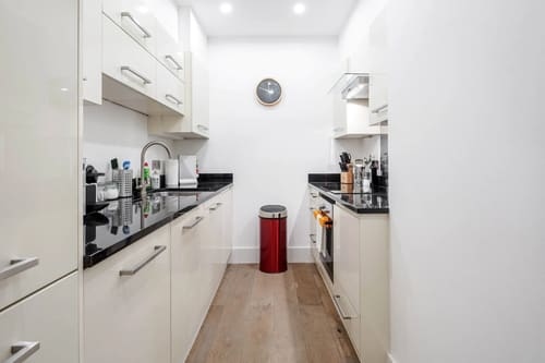 Mayfair Mews Apartment I, Mayfair: Galley kitchen with white units