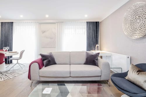Mayfair Mews Apartment I, Mayfair: Grey sofa with magenta throw
