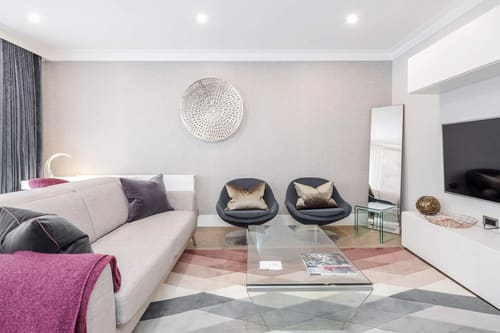 Mayfair Mews Apartment I, Mayfair: Living room with grey sofa and swivel chairs