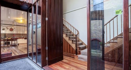 Notting Hill 3 bedroom near Ladbroke Grove, Notting Hill: Staircase seen through open timber doors