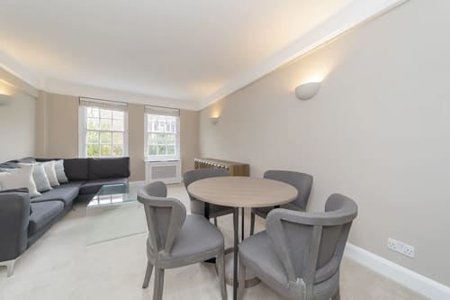 Chelsea Mansion Block, Chelsea: Dining table with grey chairs by the window
