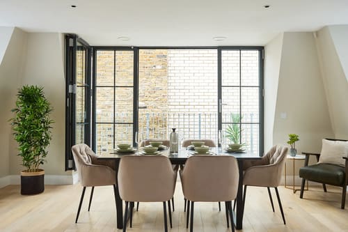 Chancery Lane Apartments, Holborn: Dining table for six by glazed doors