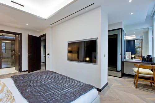 The Golden Square Apartments, West End: Bedroom with wall-mounted TV