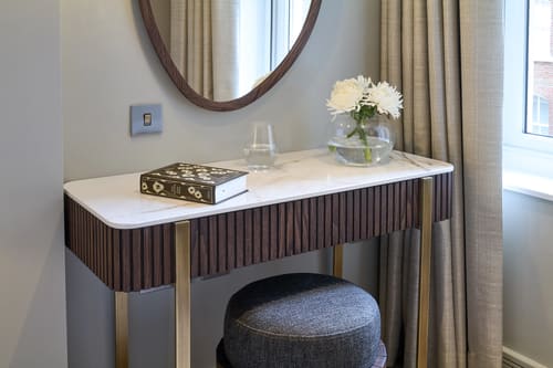 Cheval Phoenix House, Chelsea: Dressing table with fluted front and stool
