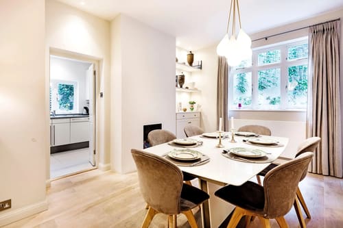Secluded 2 bedroom Belgravia House, Chelsea: Dining table with glass pendant light