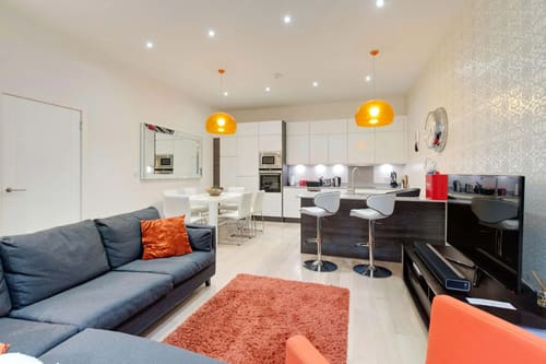 Colonnade, Bloomsbury: Open-plan kitchen and living room with orange pendant lights