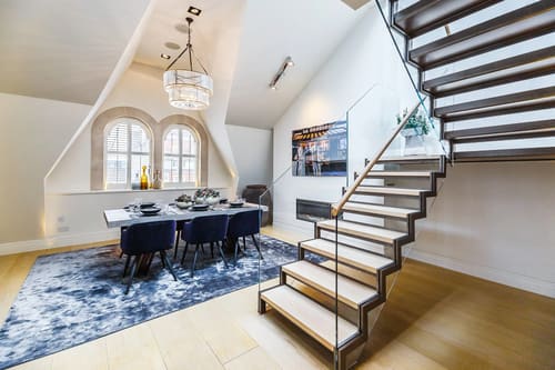 Green Street, W1K, Mayfair: Open-plan room with floating staircase and dining table