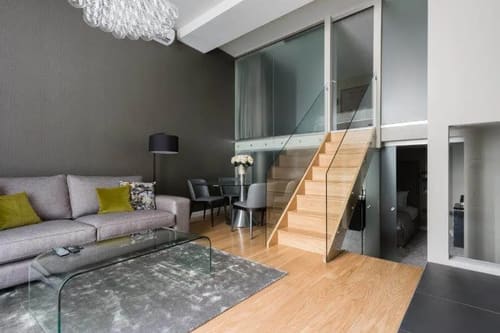 One Harrington Gardens, Kensington: Living room with mezzanine staircase