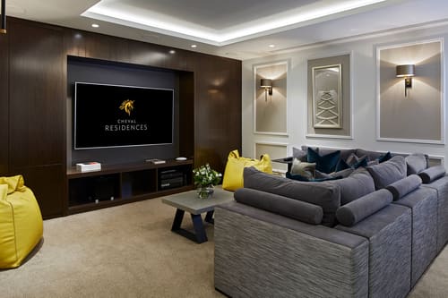 Cheval Hyde Park Gate, Kensington: Living room with grey sofa and large TV wall