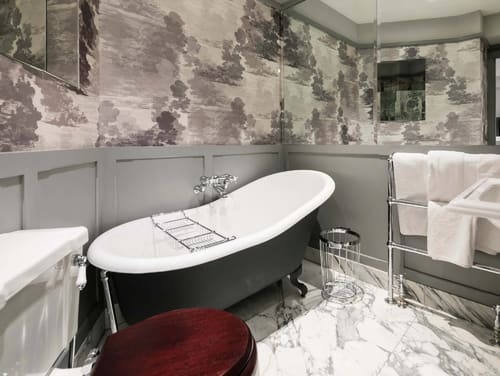 Prime Mayfair 1 bedroom no.3, W1K, Mayfair: Roll-top bath with scenic wallpaper